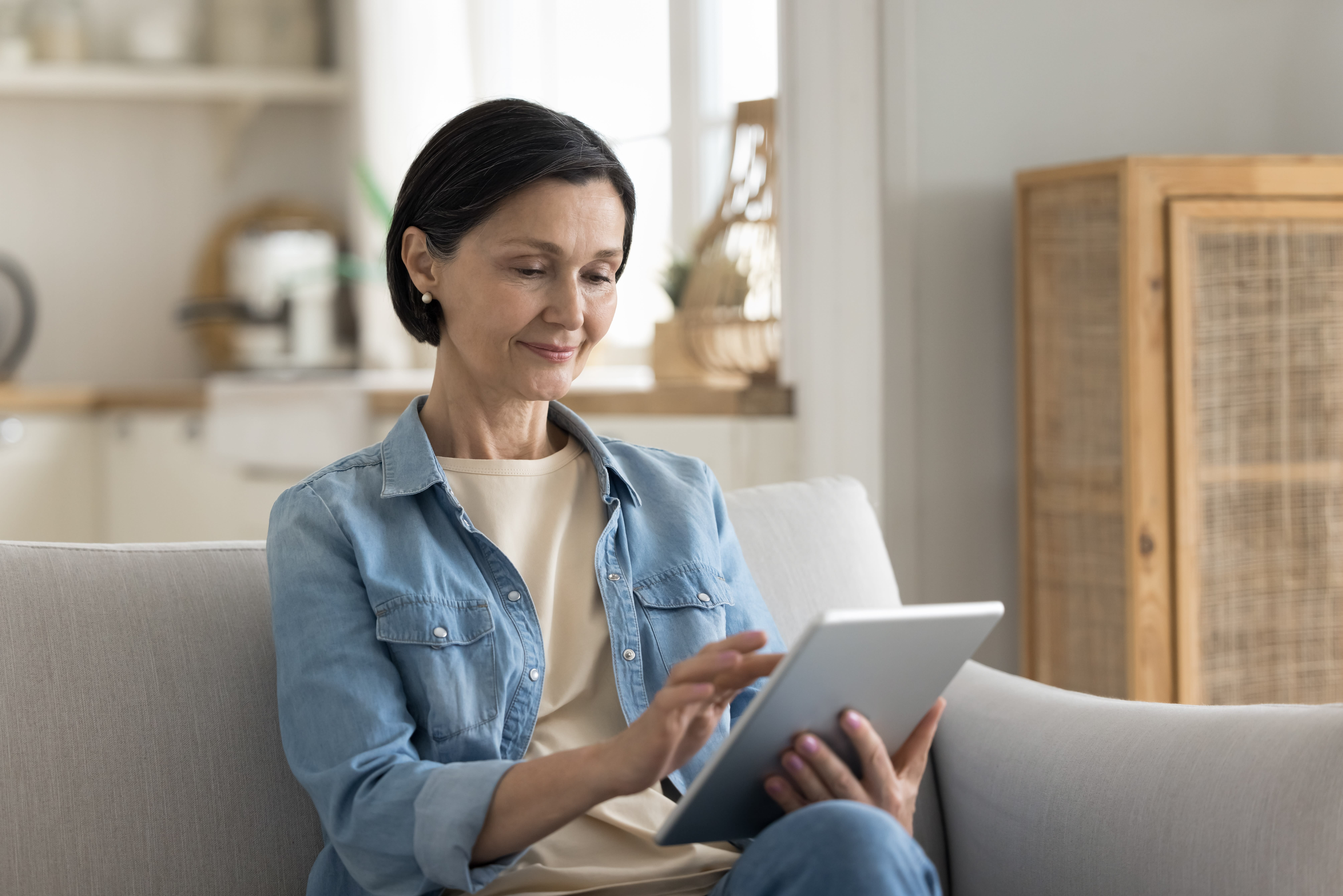 Woman reading on a tablet